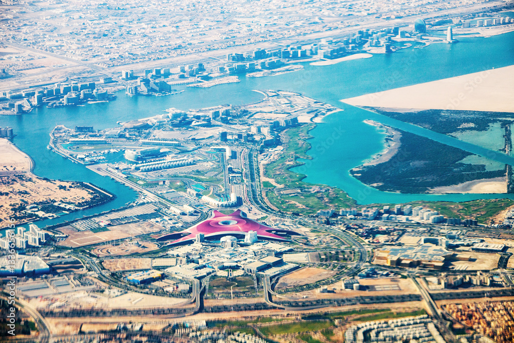 Obraz premium 23 January 2025, Abu Dhabi, UAE: Stunning aerial view of Yas Island, showing the Formula 1 circuit and the iconic Ferrari World theme park
