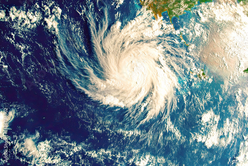 Severe tropical storm brewing over the ocean threatening coastal communities with heavy rain
