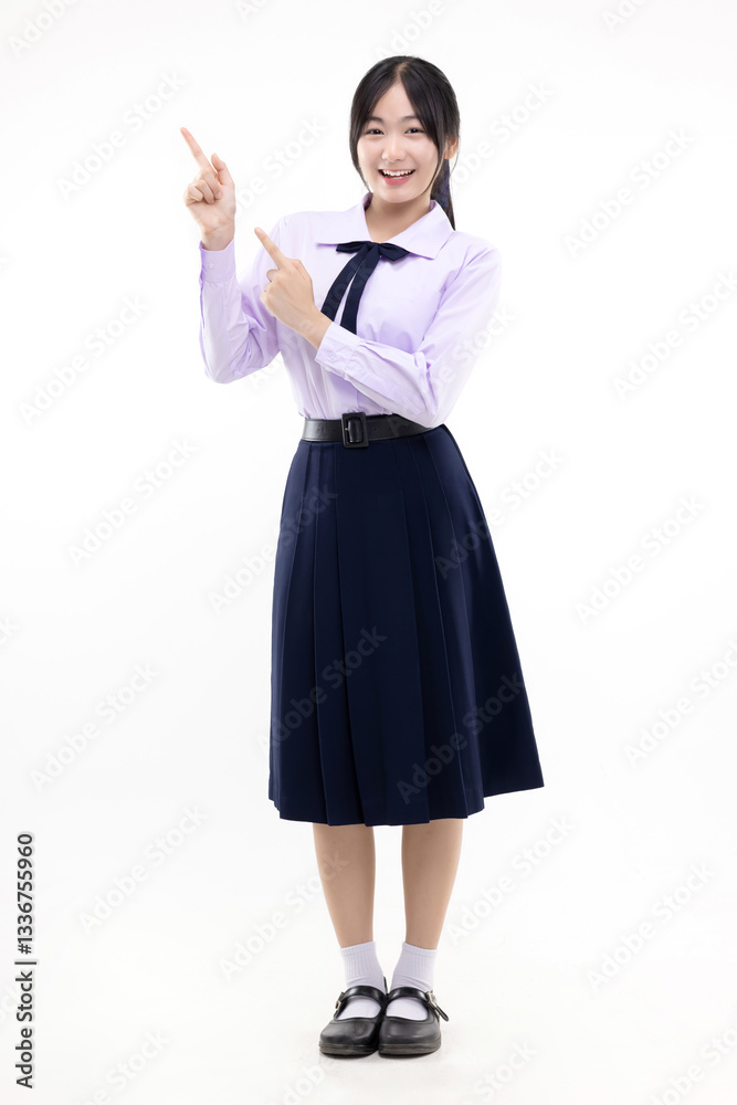 Full body Happy pretty Asian student girl in school uniform pointing finger to the side isolated on white background. Full body Happy pretty Asian student girl in school uniform pointing finger to the side isolated on white background.