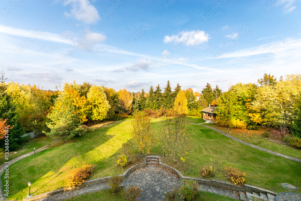 Colorful autumn landscape with trees and a gazebo in a serene natural setting during the day Colorful autumn landscape with trees and a gazebo in a serene natural setting during the day