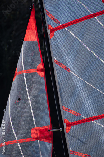 A backlit sail on a Cornish Beach