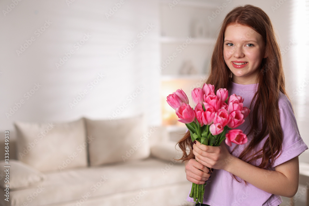 Beautiful teenage girl with bouquet of tulips indoors, space for text Beautiful teenage girl with bouquet of tulips indoors, space for text
