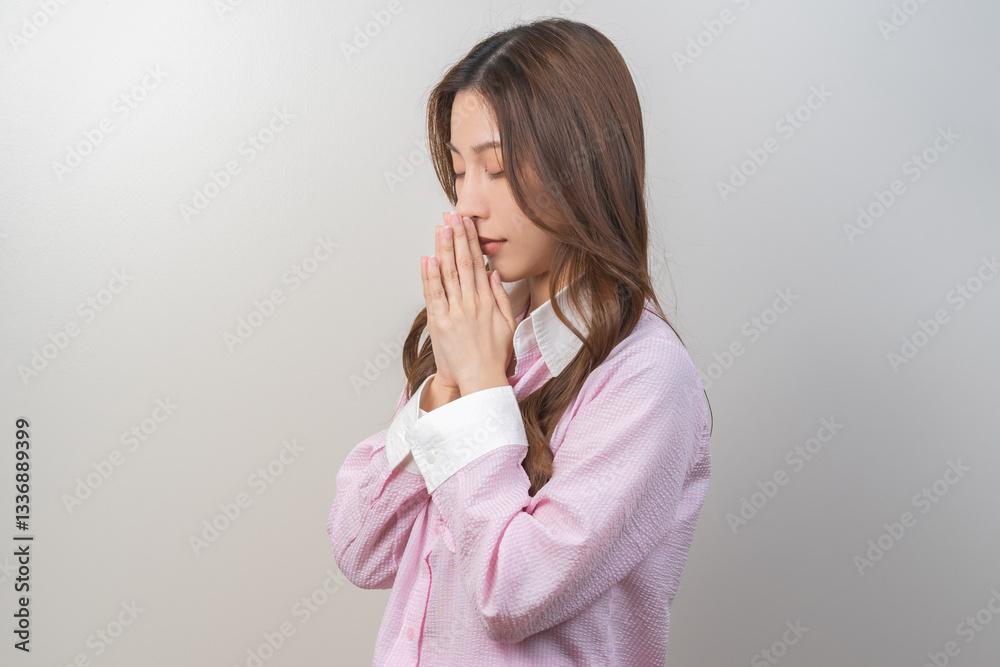 Happy believe faith, calm asian young woman, girl show gratitude, hold hands at heart chest feel grateful, beg with her eyes closed, praying to request ark God for help. Religious, forgiveness concept Happy believe faith, calm asian young woman, girl show gratitude, hold hands at heart chest feel grateful, beg with her eyes closed, praying to request ark God for help. Religious, forgiveness concept