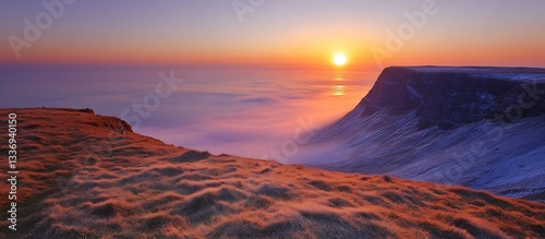 Sunset over a misty mountain valley