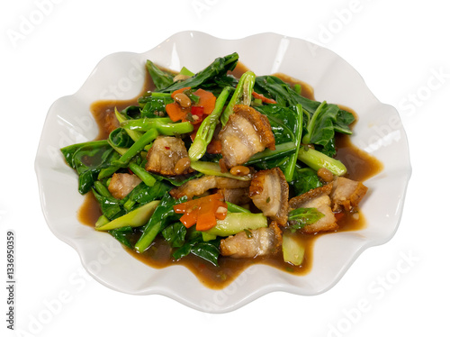 Stir fried crispy pork with kale and oyster sauce in plate 
