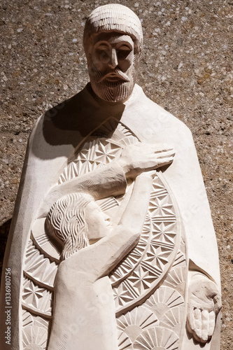 Statue of Saint Joseph holding baby Jesus Christ in his arms.