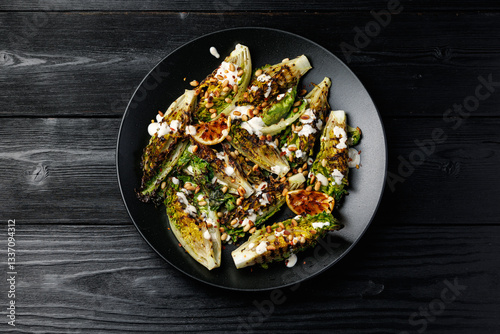 Canvastavla Grilled little gem lettuce with aioli sauce, roasted pine nuts and chilli flakes