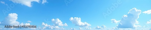 Crisp blue sky canvas with scattered, brilliant white clouds , bright, altitude, atmosphere