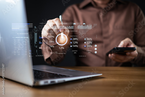 A businessman analyzes a futuristic stock trading plan with a digital graph interface, holding a smartphone and using a stylus to interact with data, symbol finance, trade, and investment strategy.