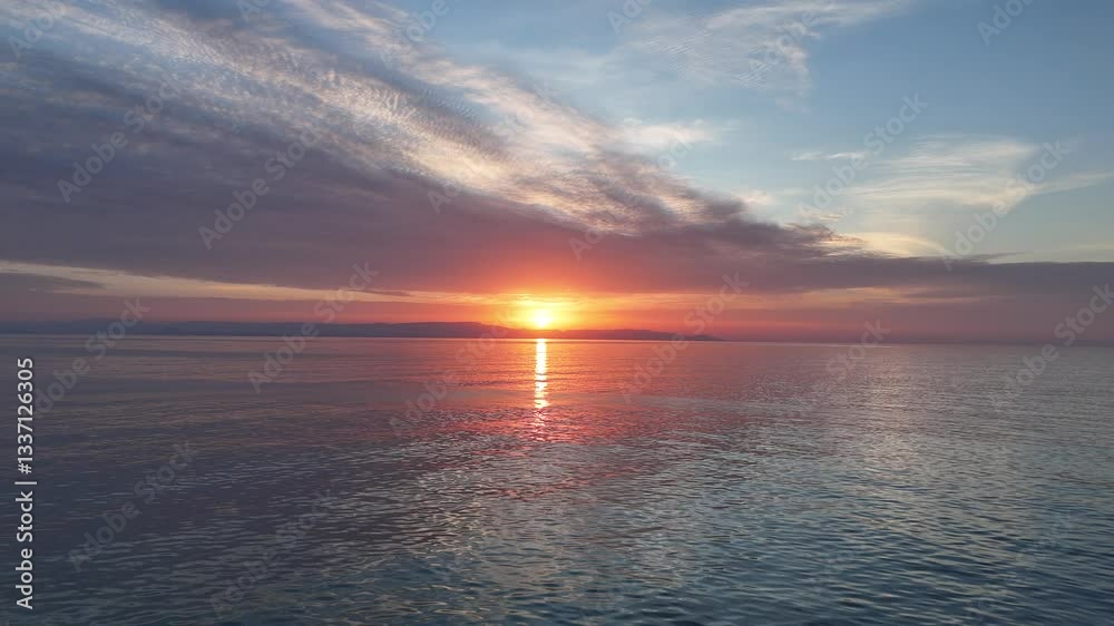 Aerial view of sunset horizon over the sea with Zakynthos island in the background in Greece