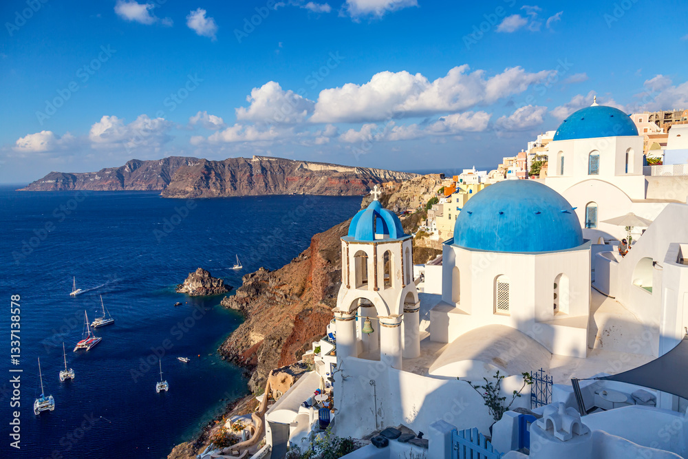 Fototapeta premium Santorini island, Aegean sea, Greece. Traditional greek Oia village panorama with famous white houses and blue churches