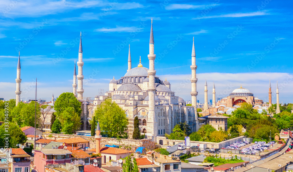 Naklejka premium Aerial drone view of Sultanahmet or Blue mosque and Hagia Sophia in Sultanahmet district in Istanbul, Turkey against blue sky.