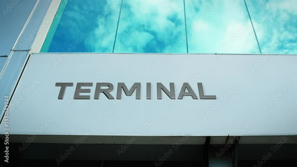 Terminal sign on a modern building with a reflection of the sky on glass windows, symbolizing transportation, travel, and airport services Terminal sign on a modern building with a reflection of the sky on glass windows, symbolizing transportation, travel, and airport services