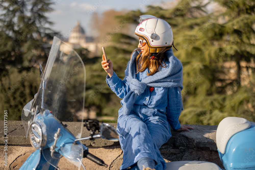 A young woman in a helmet and chic outfit sits on a stone ledge near a retro scooter, enjoying the panoramic view of Rome. A perfect image for travel, Italian lifestyle, and freedom themes