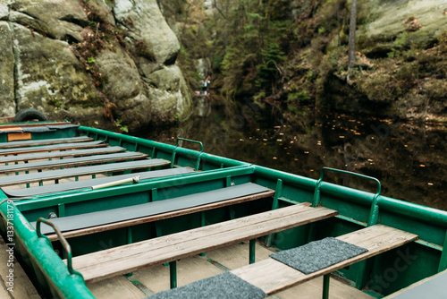 Obraz na płótnie Boat with water reflection at a river pier. Texture of sandstone, The National park Adrspach Teplice rocks. High quality photo. Nature background w salonie