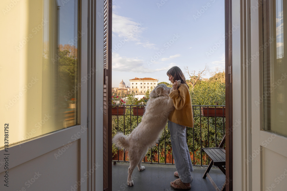 A young woman in cozy loungewear embraces her fluffy white dog on a balcony with a stunning view of Vatican City in Rome. A peaceful morning moment filled with warmth, love, and Italian charm