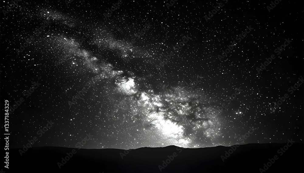 Majestic monochrome Milky Way galaxy stretches across a dark night sky, above a silhouetted landscape Majestic monochrome Milky Way galaxy stretches across a dark night sky, above a silhouetted landscape