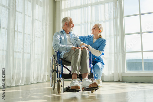 Help support retirement healthcare. Nurse helping old man in wheelchair. Patient and woman in nursing home for medical caregiver. Nurse taking care of paralyzed man in chair for people with disability