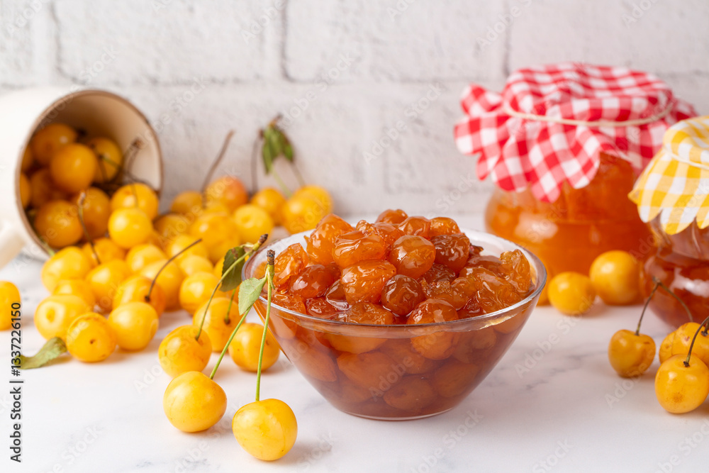Homemade DIY natural canned yellow cherry plum sauce chutney with chilli or tkemali in glass jar