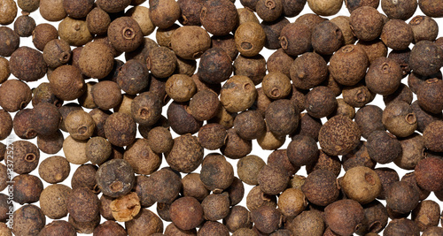 Obraz na plátne Scattered allspice, spice. Full frame