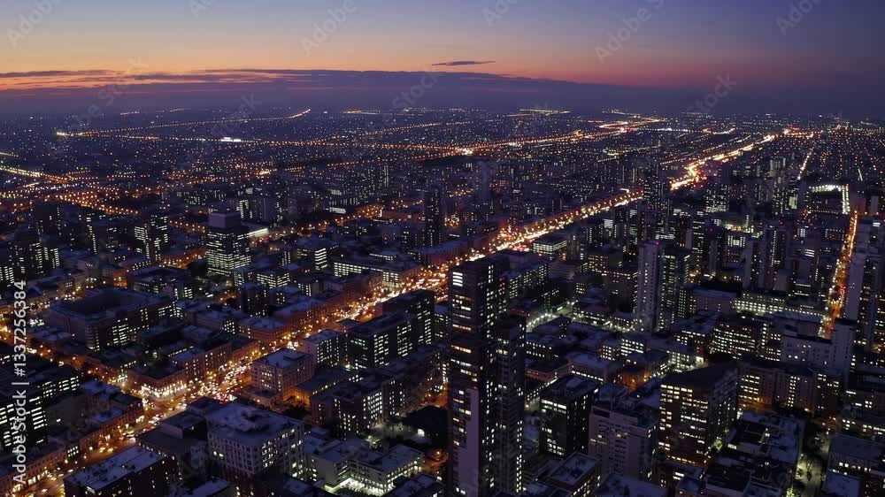 Vibrant city lights illuminate urban skyline at dusk with moving traffic Vibrant city lights illuminate urban skyline at dusk with moving traffic