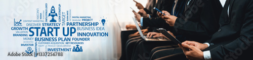 Obraz na plátně A focused business team collaborating on a startup project, emphasizing innovation and strategic planning in a modern workspace environment, ideal for entrepreneurial themes