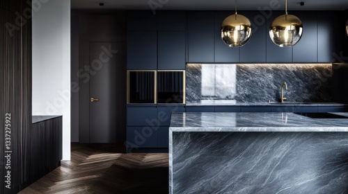 A sophisticated kitchen with dark navy blue cabinets and a sleek, polished marble countertop that has light gray veins