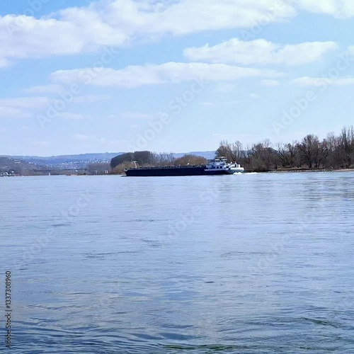 River on sunny day snd  blue sky with moving ship 