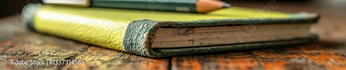 Lime green journals and notebooks, whether open or closed, sit on a wooden surface with wood nearby