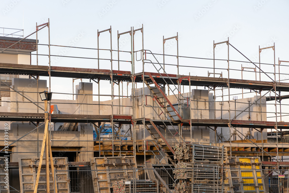 scaffolding during house construction. installation of scaffolding at a construction site scaffolding during house construction. installation of scaffolding at a construction site