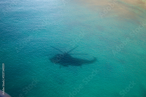 sea king helicopter shadow on the water