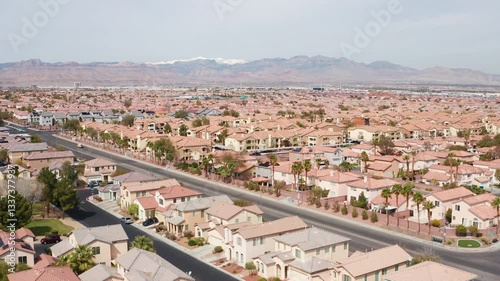 Aerial drone shot of Las Vegas suburban residence homes mountains casion 03