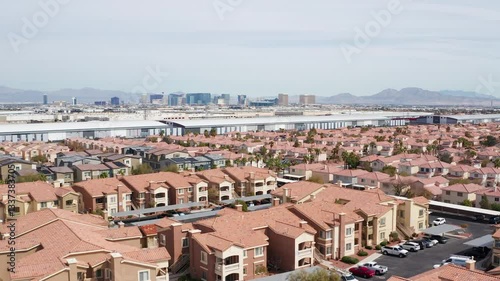 Aerial drone shot of Las Vegas suburban residence homes mountains casion 05
