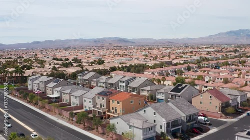 Aerial drone shot of Las Vegas suburban residence homes mountains casion 06