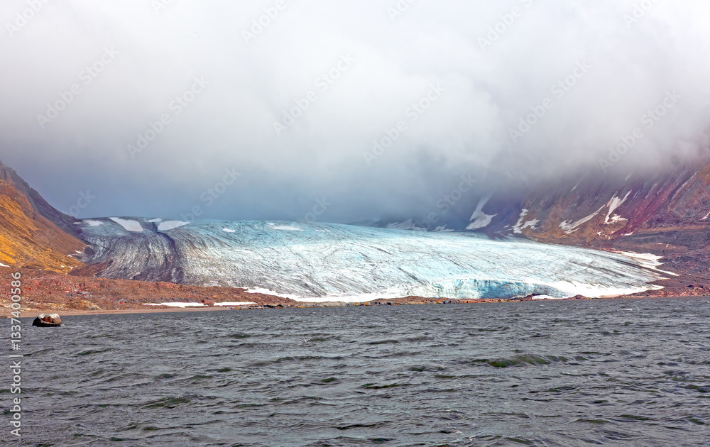 Tidal Glacier Coming Out of the Clouds