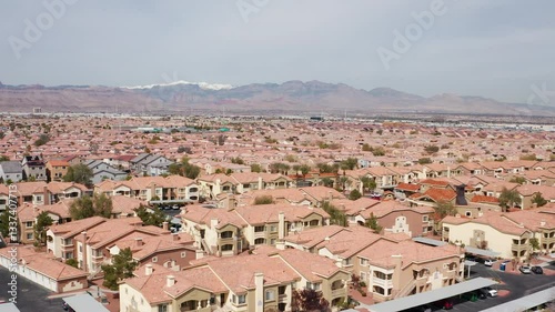 Aerial drone shot of Las Vegas suburban residence homes mountains casion 07