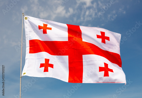 Photography Waving flag of Georgia against a cloudy sky