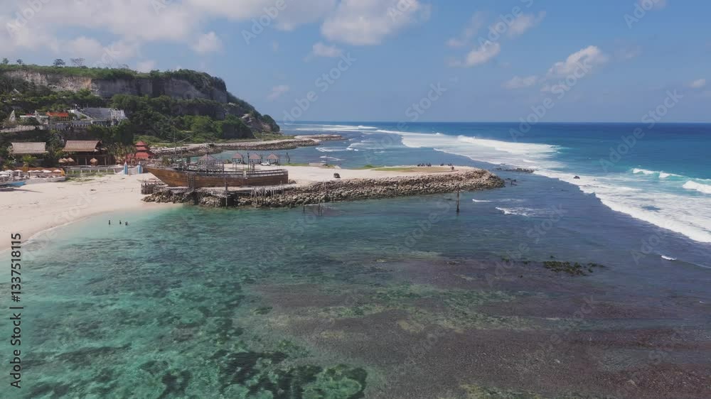 Aerial view of a tropical Bali coastline with resorts and sandy beaches Aerial view of a tropical Bali coastline with resorts and sandy beaches