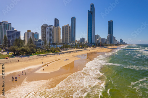 Tourists return to Surfers Paradise after the beach suffered storm damage and sand erosion caused by Cyclone Alfred