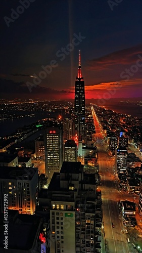 City lights and skyscrapers in the modern city at night, vertical background 