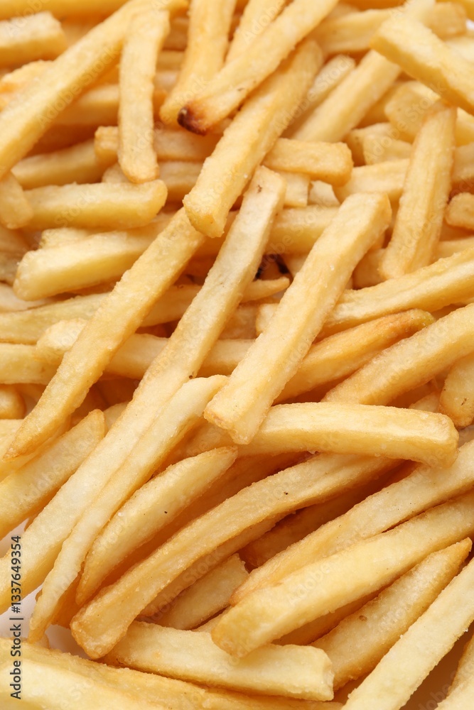 Pile of delicious French fries as background, closeup Pile of delicious French fries as background, closeup