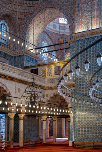 Photography Interior of the historic Rüstem Pasha Mosque in Istanbul, showcasing Iznik tilework, chandeliers, and elegant Ottoman architecture, reflecting rich heritage and craftsmanship
