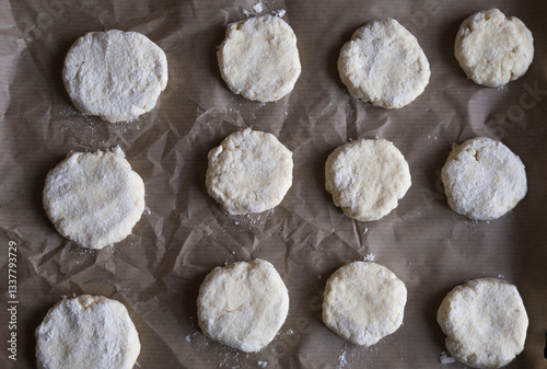 Made cookies before baking on bakery paper, from above.
