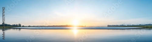 Serene Sunrise Over Tranquil Lake with Calm Reflective Water