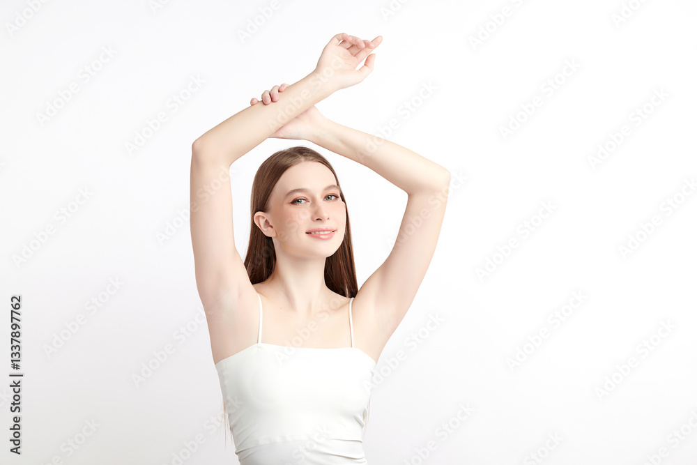 A beautiful young woman raises her arms to display her smooth and hygienic underarms against a white background, highlighting the concept of cleanliness and protection A beautiful young woman raises her arms to display her smooth and hygienic underarms against a white background, highlighting the concept of cleanliness and protection