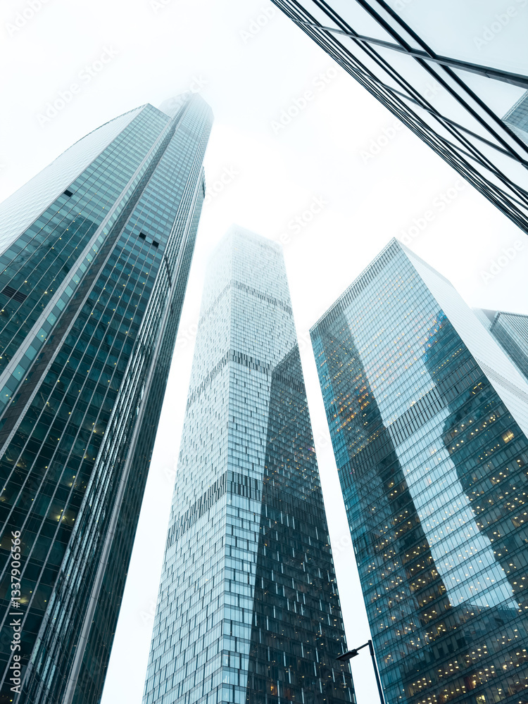 A city skyline with three tall buildings A city skyline with three tall buildings