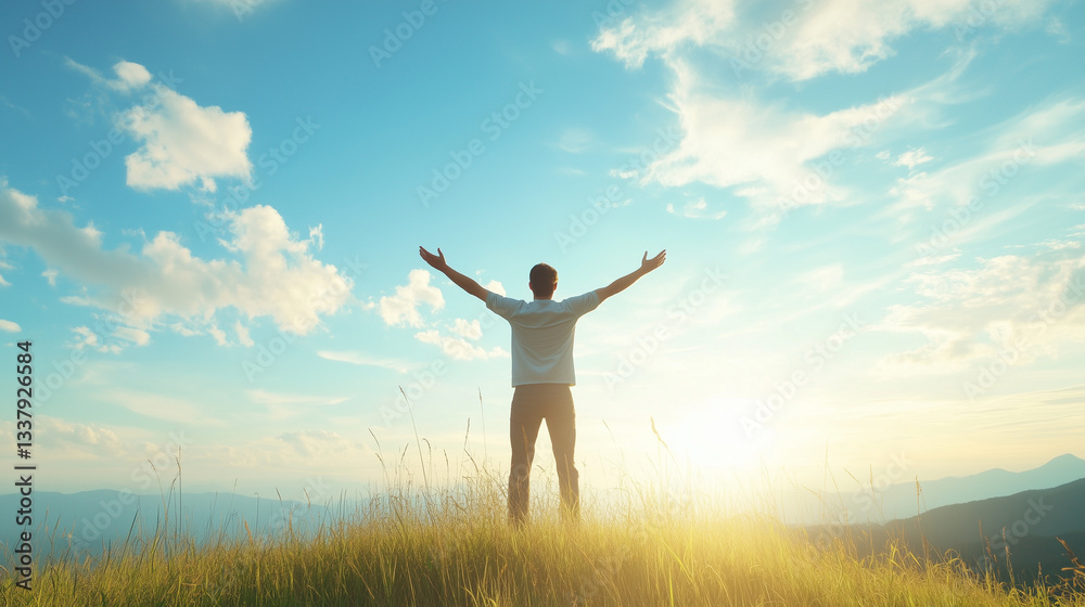 Embracing the Horizon: A silhouette of a man stands atop a grassy hill, arms outstretched, basking in the radiant glow of the sun against a stunning sky filled with fluffy clouds. Embracing the Horizon: A silhouette of a man stands atop a grassy hill, arms outstretched, basking in the radiant glow of the sun against a stunning sky filled with fluffy clouds.