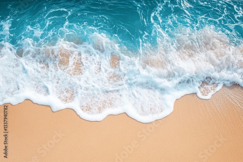 Fototapeta Naklejka Na Ścianę i Meble -  Ocean waves gently crashing on a sandy beach
