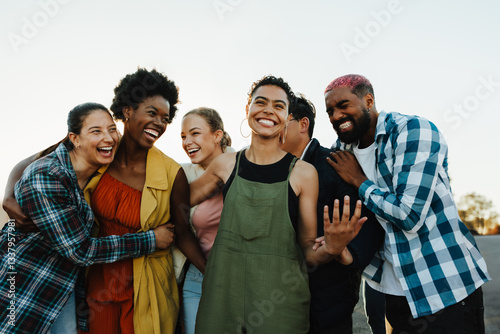 Group of young cheerful people standing together at an outdoor protest event