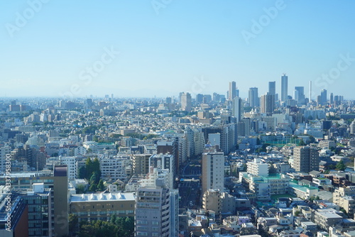 高い建高い建物から見える展望。昼間の東京の街並み。物から見える夕方の東京の街並み。